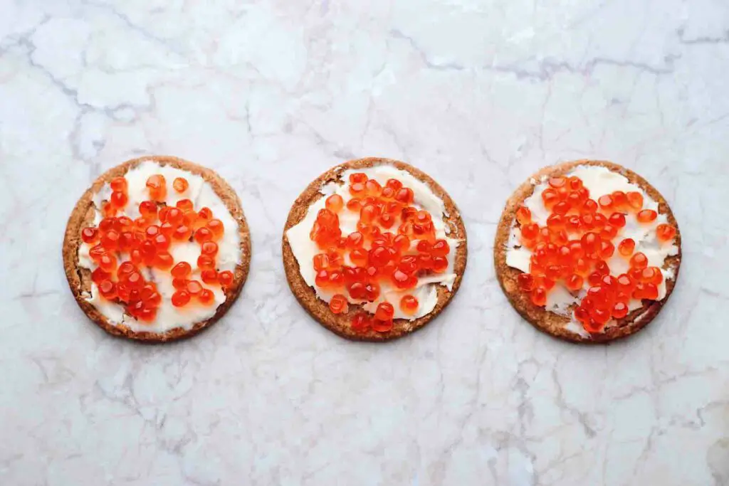 Orange caviar on biscuits