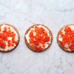 Red caviar on biscuits
