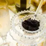 Served black caviar with a glass of champagne