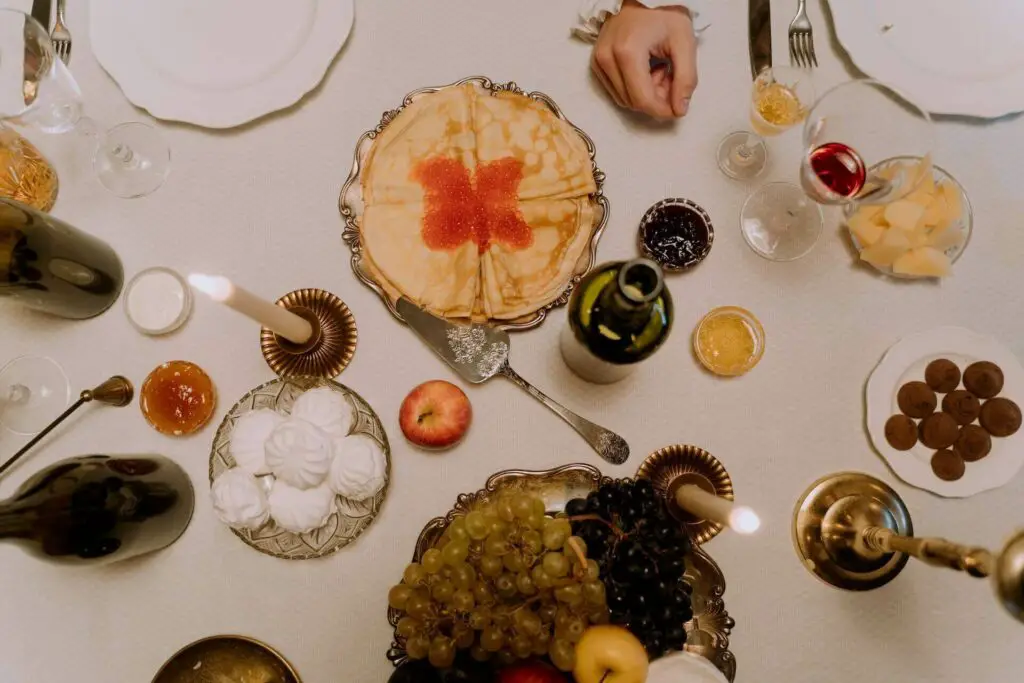 A table full of food and caviar