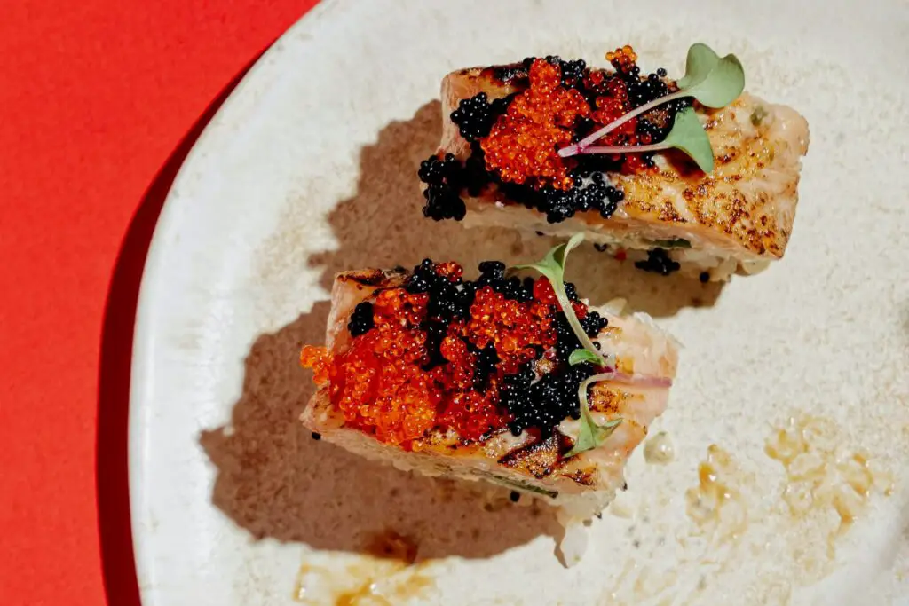 Small bites with black and red caviar
